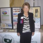 Pat Smith, President, Lyme Disease Association, in front of exhibit table ~  September 29, 2012. LDA/Columbia Annual Scientific Conference ~  (Photo: Jessica Harper Thomson)