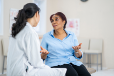 Image of a female patient having a discussion with a female doctor